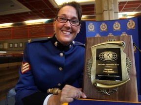 Sergeant Patti Nichol poses with her Top Cop Award during a ceremony at the downtown police headquarters on Tuesday.        PERRY MAH/EDMONTON SUN    QMI AGENCY