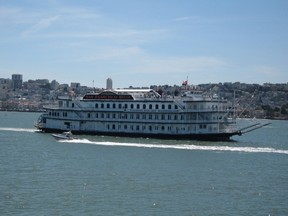 A Hornblower sightseeing cruise ship passes by with the San Francisco skyline as a backdrop. Hornblower Canada, a subsidiary of the company that runs boat tours to Alcatraz Island and to New York's Statue of Liberty, will replace the Maid of the Mist Steamboat Co., providing Niagara River tours in 2014. (QMI Agency photo)