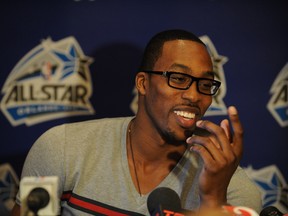 Dwight Howard talks with the media during all-star weekend in Orlando yesterday. Howard said that he plans to spend time with Jeremy Lin this weekend.