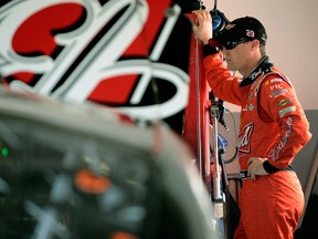 Kevin Harvick, driver of the No. 29 Budweiser Chevrolet, stands by his car in the garage during practice for the Daytona 500. (GETTY IMAGES)