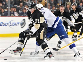 Evgeni Malkin #71 of the Pittsburgh Penguins carries the puck through center ice in the second period against the Tampa Bay Lightning on February 25, 2012 at CONSOL Energy Center in Pittsburgh, Pennsylvania.  Jamie Sabau/Getty Images/AFP