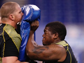 Offensive linemen Philip Blake of Baylor (right) and Tony Bergstrom of Utah take part in a drill during the 2012 NFL Combine at Lucas Oil Stadium on Feb. 25, 2012 in Indianapolis, Indiana.  (Joe Robbins/Getty Images/AFP)