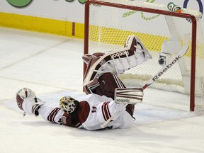 Phoenix Coyotes goaltender Mike Smith flops on the ice after Edmonton Oilers forward Ben Eager was called for a tripping penalty  at Rexall Place on Saturday.
Ian Kucerak, Edmonton Sun