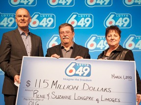 Senior Vice President of Lottery at OLG Greg McKenzie, left, presents Rene and Suzanne Longpre of Limoges with a cheque for $11.5 million at the OLG Prize Centre Thursday. The couple won the LOTTO 6/49 jackpot prize after purchasing a ticket for the February 25, 2012 draw. (OLG Winners)