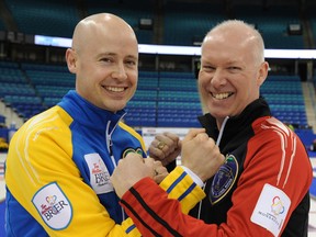 Kevin Koe and Glenn Howard ham it up at Saskatchewan Place Friday during practice before the Tim Hortons Brier. (QMI Agency)
