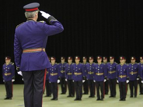 Police chief Keith McCaskill salutes graduates during the Winnipeg Police Service Graduation Ceremony in 2008. (JASON HALSTEAD/Winnipeg Sun)