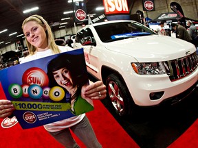 The Sun's Tamara Rempel says it's time for a lucky Sun reader to drive away in a  2012 Jeep Cherokee which will be given away Sunday at the Edmonton Motor Show. And yes – our popular Bingo contest also kicks off. (CODIE MCLACHLAN/Edmonton Sun)