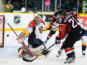 The Niagara Ice Dogs faced the Erie Otters in a strange OHL game in March 2012. The Erie goalie was injured in the first two minutes of the hockey game forcing the team to dress centreman Connor Crisp as their backup. Crisp(1) makes the stop on this shot by Niagara's Carter Verhaeghe(21). 
BOB TYMCZYSZYN/ST. CATHARINES STANDARD/QMI AGENCY