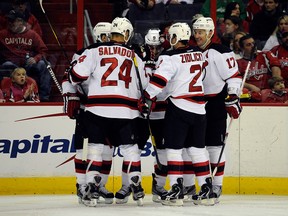 Zach Parise, Bryce Salvador, Ilya Kovalchuk and Adam Henrique of the New Jersey Devils celebrate after scoring a goal against the Washington Capitals. (Patrick McDermott/Getty Images/AFP)