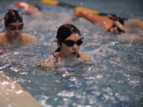 Norfolk Hammerheads Imogene Stortini (front) and Mackenna Ferreira participate in Monday’s “Swim to Boston” swimathon to raise money for the club. The annual event saw 110 swimmers taking part and brought in around $8,000 for the Norfolk Hammerheads Aquatic Club. (JACOB ROBINSON Simcoe Reformer)
