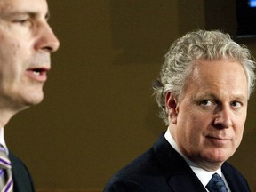 Quebec Premier Jean Charest met with Ontario Premier Dalton McGuinty at Queen's Park in Toronto on Monday. They spoke to media following their meeting. (MICHAEL PEAKE/ TORONTO SUN)