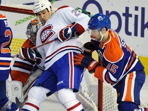 Oilers’ Nick Schultz tangles with Canadiens forwar Brad Staubitz Thursday at Rexall Place. (Reuters)
