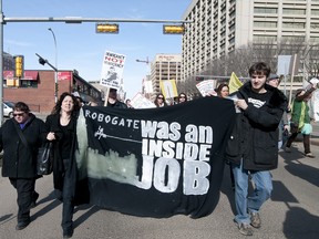 A group of demonstrators, including members of Occupy Edmonton, the Council of Canadians and the Industrial Workers of the World rallied at the Alberta Legislature in Edmonton, Alta. on March 10, 2012. The demonstration, which saw a crowd of approximately 100 people walk down local streets to the legislature, was held in response to the robocall controversy and was part of a nationwide protest.  IAN KUCERAK/QMI AGENCY