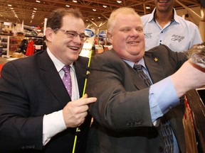 Toronto Mayor Rob Ford and Toronto Sun publisher Mike Power catch some fish at the fish pond at the Toronto Sportsmen Show, Wednesday. (CRAIG ROBERTSON/Toronto Sun)
