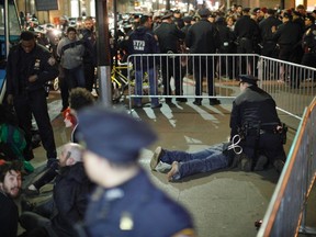 Members of the Occupy Wall St movement are arrested by NYPD officers after protesting at Zuccotti park in New York March 17, 2012.  REUTERS/Eduardo Munoz