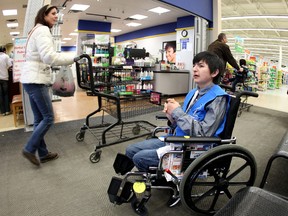 Rollie greets people at the St Albert Walmart in St. Albert Tuesday.    Rollie is celebrating his 16th birthday, his greatest wish is to be a Walmart greeter and to be in the Edmonton Sun.      PERRY MAH/EDMONTON SUN      QMI AGENCY