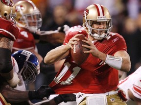 San Francisco 49ers quarterback Alex Smith is pressured by New York Giants defensive end Jason Pierre-Paul in the third quarter during the NFL NFC Championship game in San Francisco last season. (REUTERS/Jeff Haynes)