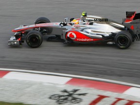 Lewis Hamilton drives during the qualifying session of the Malaysian Grand Prix at Sepang International Circuit outside Kuala Lumpur on Saturday, March 24, 2012. (Samsul Said/Reuters)