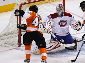 Philadelphia Flyers winger Danny Briere scores a goal past Montreal's goalie Peter Budaj during the second period of their game in Philadelphia, March 24, 2012. (REUTERS/Tim Shaffer)