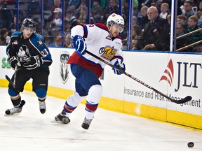Griffin Reinhart gets chased by his brother Max at Rexall Place on Friday. With the three NHL-bred brothers — along with Sam — facing off in a WHL playoff series, the family questions aren’t about to stop.
Amber Bracken, Edmonton Sun