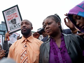 Tracy Martin (L), father of slain Florida teen Trayvon Martin, and Sybrina Fulton, Trayvon Martin's mother, join a protest called "A Million Hoodies March" to demand justice for their son's death in New York's Union Square March 21, 2012. (REUTERS/Andrew Burton)