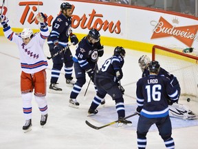 The Jets are caught standing around watching as Brian Boyle celebrates his game-winning goal. It wasn’t a big surprise to see Winnipeg suffer a letdown. (FRED GREENSLADE/Reuters)