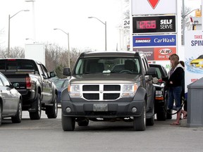 There was a long lineup of  drivers and their vehicles waiting to get gas at the Kingston Centre Canadian Tire Gas Bar on Tuesday afternoon around 1 p.m. when the price was $1.26.6 per litre. Later in the afternoon gas prices in Kingston had risen to $1.38.9 per litre. (Ian MacAlpine/ QMI Agency)