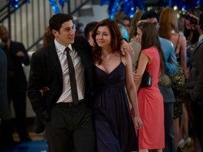 Jim (JASON BIGGS) and Michelle (ALYSON HANNIGAN) reminisce in "American Reunion".  In the comedy, all the "American Pie" characters we met a little more than a decade ago return to East Great Falls for their high-school reunion.