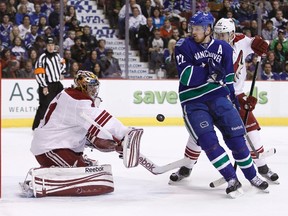 Canucks forward Daniel Sedin is stopped by Coyotes goaltender Mike Smith at Rogers Arena in Vancouver, B.C., March 14, 2012. (BEN NELMS/Reuters)