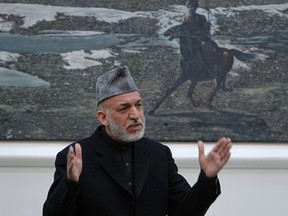 Afghanistan's President Hamid Karzai speaks during a meeting with the family members of civilians killed by U.S. soldier in Kandahar last week at the presidential palace in Kabul March, 16, 2012. REUTERS/Omar Sobhani