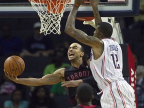 Toronto Raptors' Jerryd Bayless goes up for a layup against Bobcats' Tyrus Thomas during their weekend game in Charlotte. (REUTERS)
