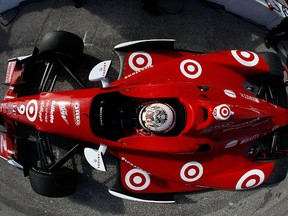 Scott Dixon of New Zealand, driver of the No. 9 Target Chip Ganassi Racing Honda Dallara DW12 waits in the pits during testing for the IZOD INDYCAR Series which starts Sunday in St. Petersburg, Fla.