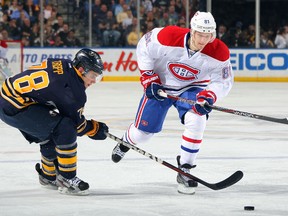 Corey Tropp of the Buffalo Sabres defends against Montreal's Lars Eller Wednesday night in Buffalo. (Dave Sandford/Getty Images/AFP)