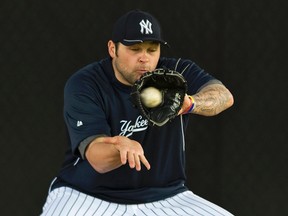 Yankees pitcher Joba Chamberlain had surgery after injuring his ankle while playing with his son on Thursday. (Steve Nesius/Reuters/Files)