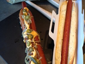 The Texas Rangers introduced The Champion Dog, a 2-foot-long hot dog at the Rangers Ballpark in Arlington, Texas on March 23, 2012. (REUTERS/Jon Nielsen)