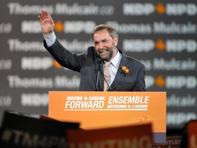 Leadership candidate Thomas Mulcair waves while speaking to delegates during the NDP Leadership Convention in Toronto March 23, 2012. REUTERS/Mike Cassese
