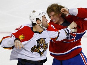 Panthers defenceman Erik Gudbranson fights with Canadiens forward Ryan Whiteat the Bell Centre in Montreal, Que., March 27, 2012. (OLIVIER JEAN/Reuters)