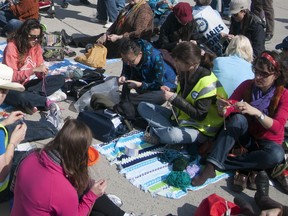 Striking employees of the Toronto Pubic Library staged a knit-in outside of City Hall on Wednesday (Mark Tarnovetsky/Toronto Sun)