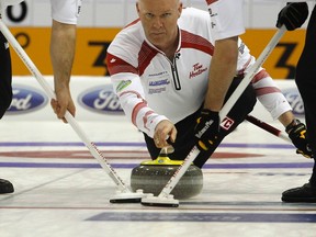 Glenn Howard delivers his stone during play against Switzerland at the World Men's Curling Championship in Basel on Tuesday, April 3, 2012. (Arnd Wiegmann/Reuters)