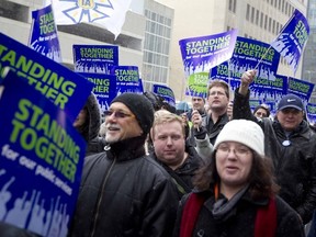 Demonstrators take part in a public service union demonstration on the forthcoming budget and staff cuts, in Ottawa, March 1, 2012. (Chris Roussakis/QMI Agency)