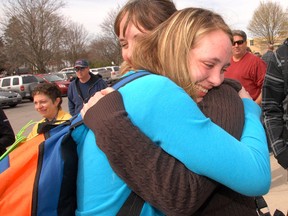 Jessica McDonald gets a big hug from her mom Penny before boarding a bus Tuesday at Parkside Collegiate heading off on their school trip to Vimy. A group of 42-students and six chaperones have been planning and saving for over a year to attend the commemoration of the anniversary of the Battle of Vimy Ridge. (ROBERT CHAULK/QMI Agency)