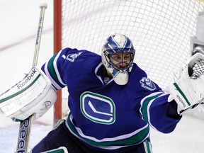 Vancouver Canucks goaltender Roberto Luongo makes a save against the Edmonton Oilers during their game in Vancouver on April 7, 2012. (REUTERS/Ben Nelms)