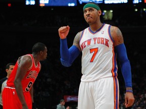 New York Knicks small forward Carmelo Anthony reacts against the Chicago Bulls in the third quarter of their NBA basketball game at Madison Square Garden in New York, April 8, 2012. (REUTERS/Adam Hunger)