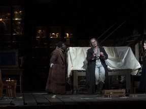 Russell Thomas as Hoffmann (left), John Relyea as the Four Villains and Lauren Segal as The Muse/Nicklausse in the Canadian Opera Company production of The Tales of Hoffmann.