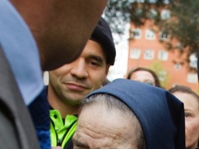 Spanish nun Maria Gomez Valbuena leaves a courthouse after appearing before a judge about a baby abduction case in Madrid on April 12, 2012. (REUTERS/Susana Vera)