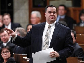 Canada's Heritage Minister James Moore speaks during Question Period in the House of Commons on Parliament Hill in Ottawa April 4, 2012.    (REUTERS/Chris Wattie)