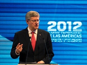 Prime Minister Stephen Harper addresses the audience during the CEO Summit as part of the Americas Summit in Cartagena April 14, 2012. (REUTERS/John Vizcaino)