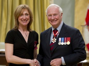 Gov. Gen. David Johnston presents the Medals of Bravery to Dawn Manning at a ceremony at Rideau Hall in Ottawa,  April 20, 2012. (Chris Roussakis/QMI Agency)