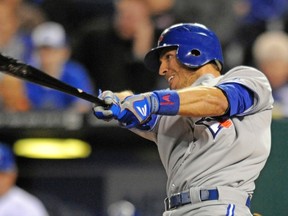 Toronto Blue Jays' J.P. Arencibia hits an RBI single in the fifth inning against the Kansas City Royals. (Dave Kaup/REUTERS)