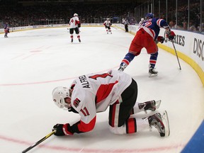 Daniel Alfredsson of the Ottawa Senators lays on the ice following an elbow from Carl Hagelin of the New York Rangers that resulted in a major penalty in Game Two of the Eastern Conference Quarterfinals during the 2012 NHL Stanley Cup Playoffs at Madison Square Garden on April 14, 2012 in New York City. Alfredsson left the game following the hit.  (Bruce Bennett/Getty Images/AFP)